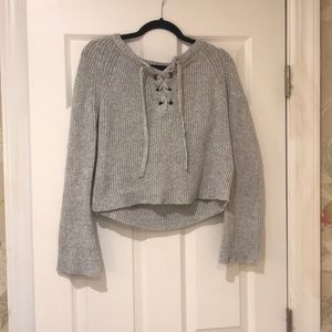 Trendy grey sweater with lace up front